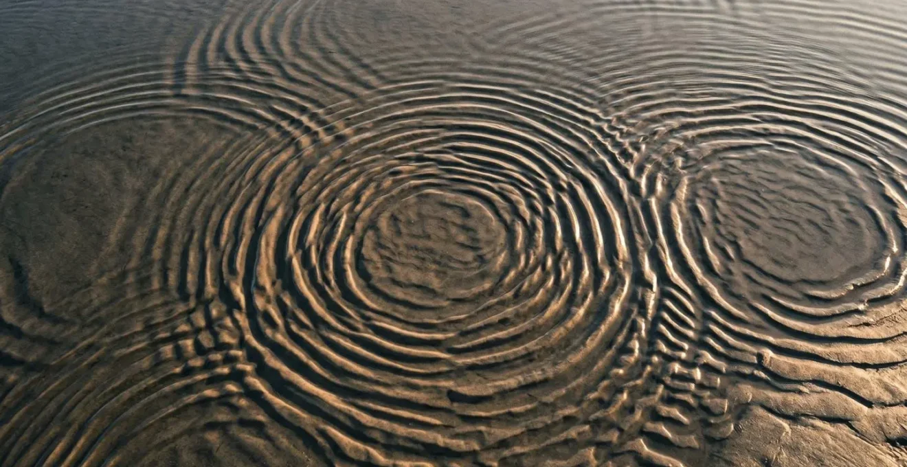 Abstract visualization of overlapping sound waves creating auditory illusions through frequency layering